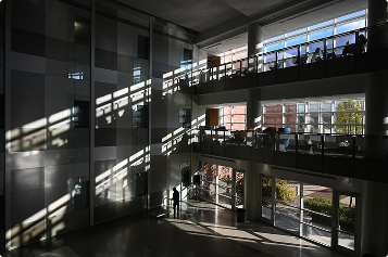 sunlight streams in the windows of the Klaus school of computing atrium